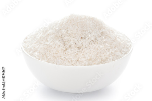 Close-up Monosodium glutamate MSG transparent crystal  in white bowl isolated on white background.