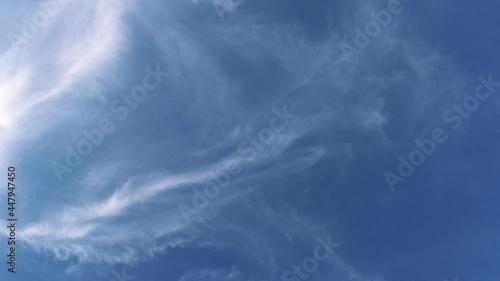 White clouds against blue sky at sunset