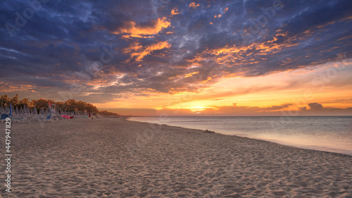 Fototapeta Naklejka Na Ścianę i Meble -  Landscape of beautiful sea and beach sunrise, seascape and hill mountain on backgrond, Simeri Mare, Calabria, Southern Italy