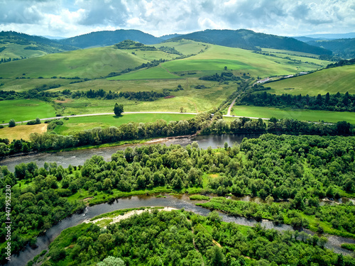 Beautiful aerial panoramic view of the Pieniny National Park, Poland in sunny day. Sokolica and Trzy Korony - English: Three Crowns (the summit of the Three Crowns Massif) and Dunajec river