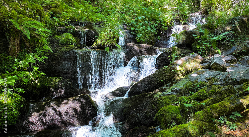 Beautiful waterfall surrounded by beautiful plants in Spain Beautiful waterfall surrounded by beautiful plants in Spain