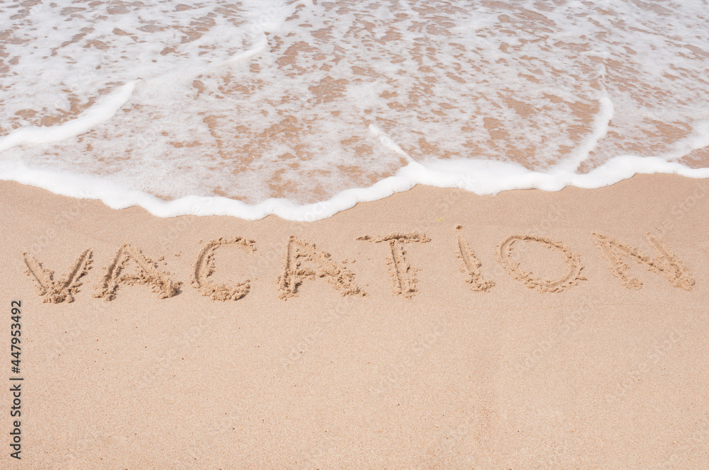Fototapeta premium Vacation Inscription on a sandy sea coast