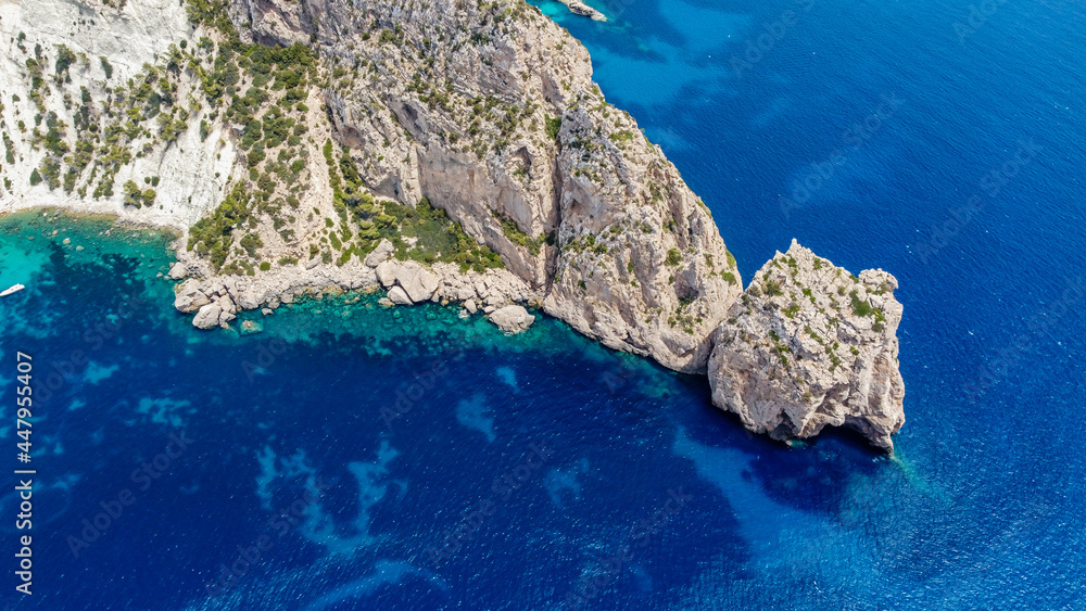 Rocky cliffs near Es Vedra at the westernmost tip of Ibiza island, Spain - Dramatic seascape near Torre des Savinar overlooking the Mediterranean Sea