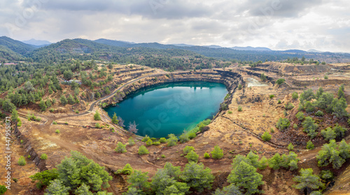 Panorama of old copper mining area with lake and mine tailings near Kapedes, Cyprus photo