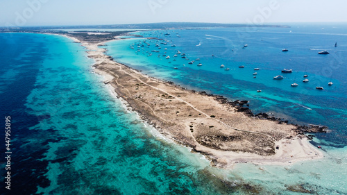 Aerial view of the beaches of Ses Illetes on the island of Formentera in the Balearic Islands, Spain - Turquoise waters on both sides of a sand strip in the Mediterranean Sea © Alexandre ROSA