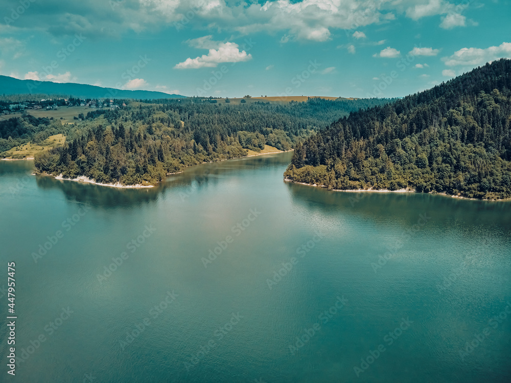 Beautiful aerial panoramic view of the Lake Czorsztyn (Polish: Jezioro Czorsztynskie) is a man-made reservoir on the Dunajec river, southern Poland, between the Pieniny and the Gorce Mountains
