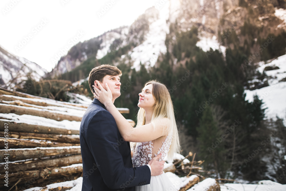 Loving husband and woman on the background of the mountains. Loving couple emotionally spends time Loving husband and woman on the background of the mountains. Loving couple emotionally spends time