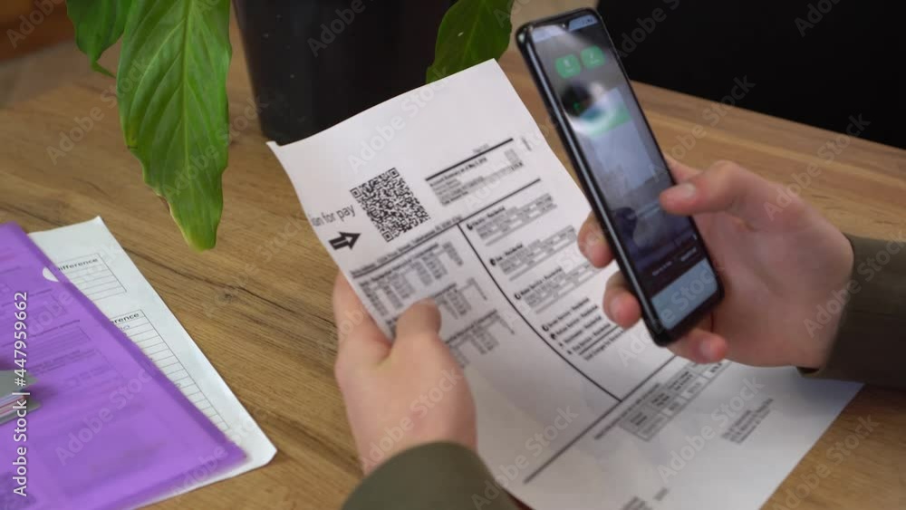 QR Utility Bill. Mobile Bill Payment with QR Codes. A woman scanning ...