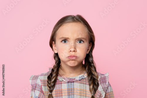 Fényképezés bored girl puffing cheeks while looking at camera isolated on pink