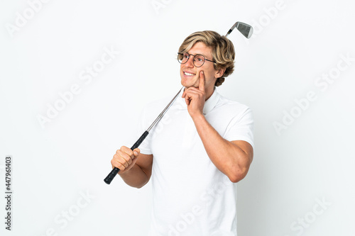 English man playing golf thinking an idea while looking up