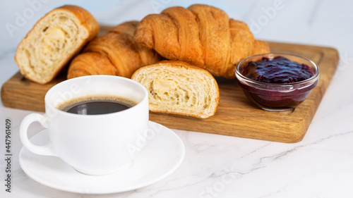 Fototapeta Naklejka Na Ścianę i Meble -  cup of coffee and croissants with jam
