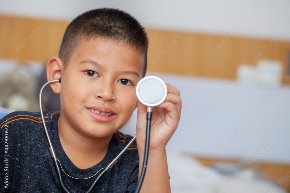 Cute small kid boy wear medical holding stethoscope playing doctor, happy funny little preschool child pretending pediatrician looking at camera, portrait. Cute small kid boy wear medical holding stethoscope playing doctor, happy funny little preschool child pretending pediatrician looking at camera, portrait.