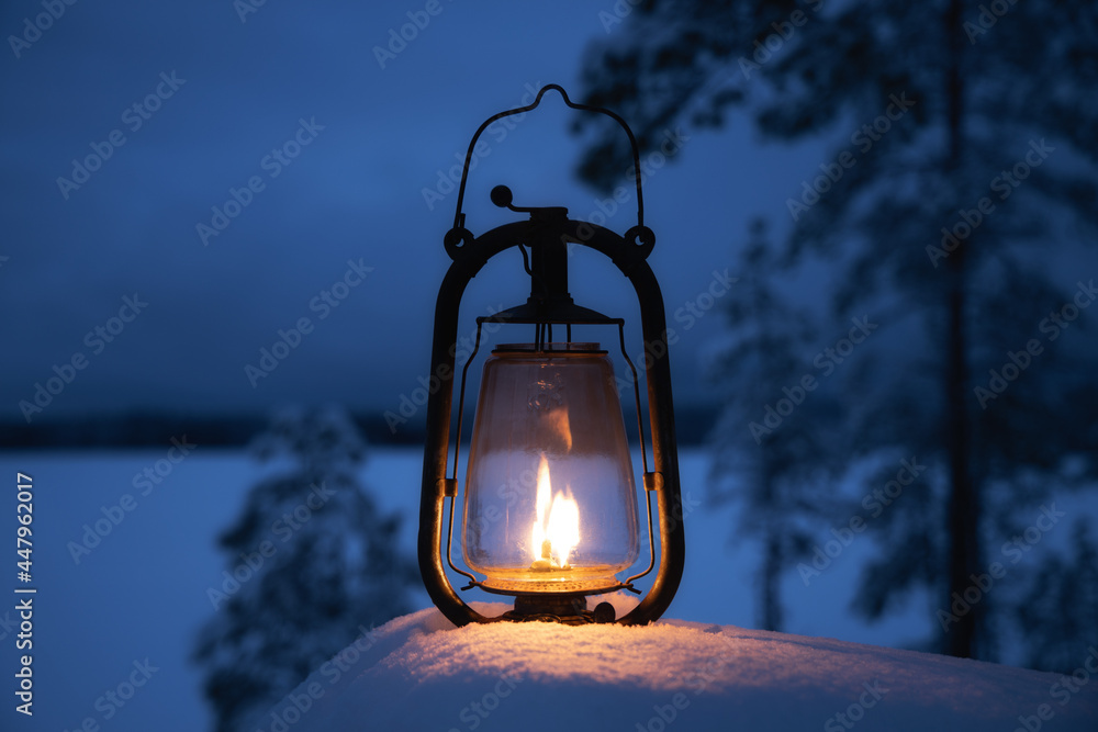 Old lantern in the night. Camping in the forest at winter season. Ancient  lamps. Lighting by the old-fashioned method. Stock Photo | Adobe Stock