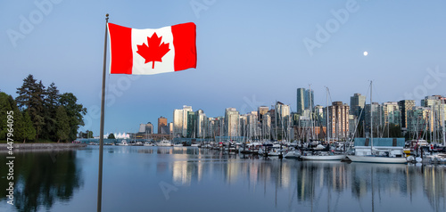 Marina and Downtown Modern City Skyline in Coal Harbour viewed from Stanley Park. Sunset Twilight in Summer. Vancouver, British Columbia, Canada. Canadian National Flag Composite