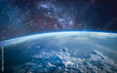 Fototapeta Naklejka Na Ścianę i Meble -  Earth in the outer space. Orbit of planet. Sun light and stars on background. Milky way. Elements of this image furnished by NASA