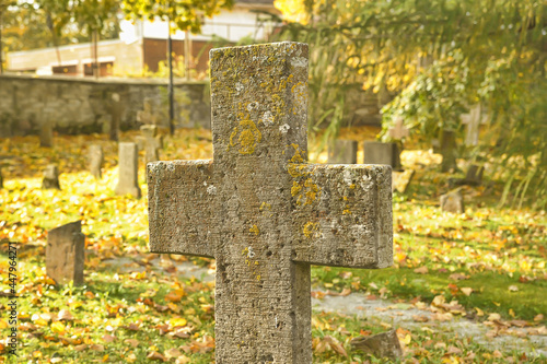 Stone crosses in the old cemetery in autumn