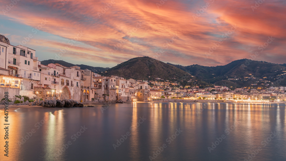 Old building on beach in Cefalu at night. Sicily stock photo. Cityscape, Sicily, Cefalu, Europe, Beach