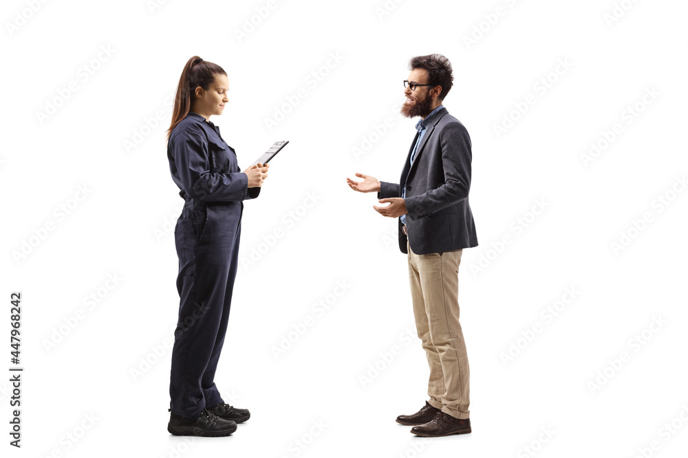 Full length profile shot of female auto mechanic having a conversation with a customer Full length profile shot of female auto mechanic having a conversation with a customer