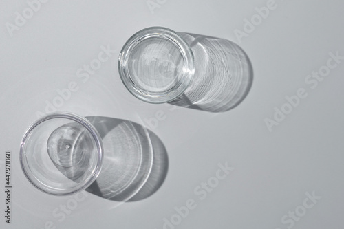 Empty glasses on white background, top view