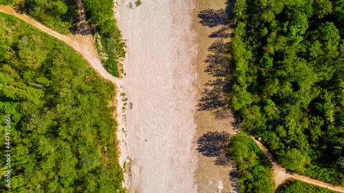 Aerial view of creek with not water and crossing road