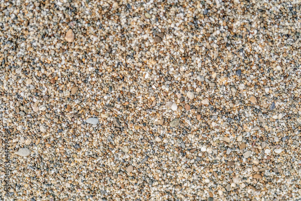 The texture of coarse sand near. Macro. The texture of coarse sand near. Macro.