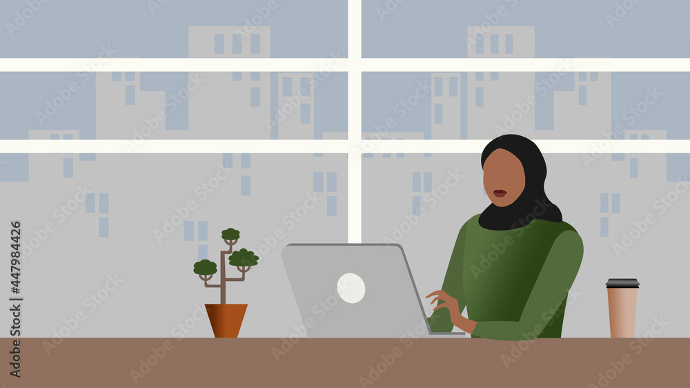 Fototapeta premium Young Muslim woman using laptop at home or office. Education or office work concept. 