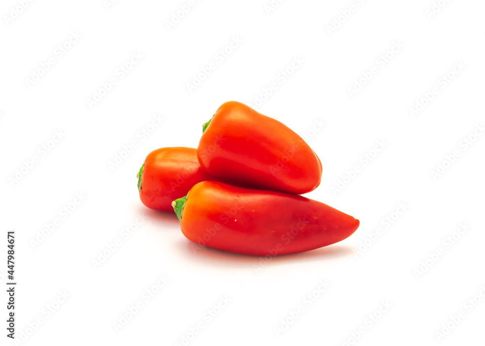 Three organic red mini sweet peppers snack isolate on white Three organic red mini sweet peppers snack isolate on white