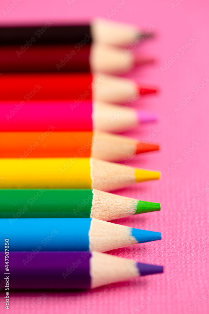 Set of Rainbow Colored Pencils on a Bright Pink Background Set of Rainbow Colored Pencils on a Bright Pink Background