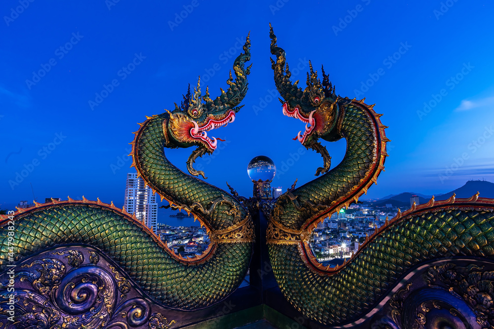Big Nagas or serpent with glass ball in Thailand.