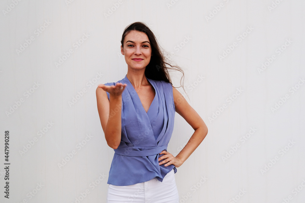 Portrait of pretty brunette wearing stylish blue top. Beautiful caucasian European female Portrait of pretty brunette wearing stylish blue top. Beautiful caucasian European female