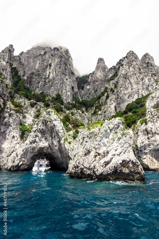 cliffs and rocks in the sea of the island of capri in italy