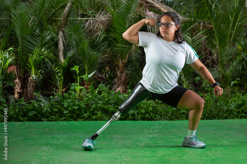 Mexican woman with prosthetic leg exercising outside  photo
