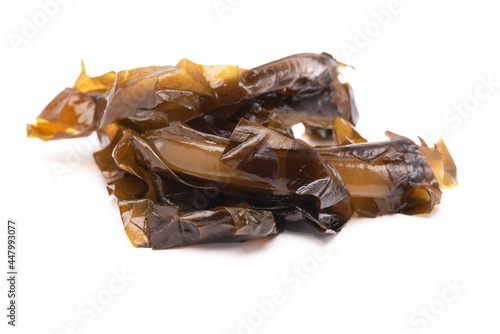 Fresh brown seaweed wakame isolated on white background. Japanese healthy food