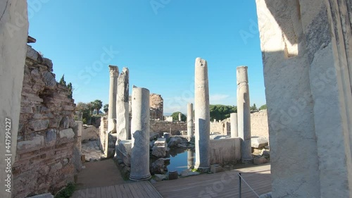 Walking into the ruins of Scholastica Baths from marble door frame in the ancient city of Ephesus.  photo