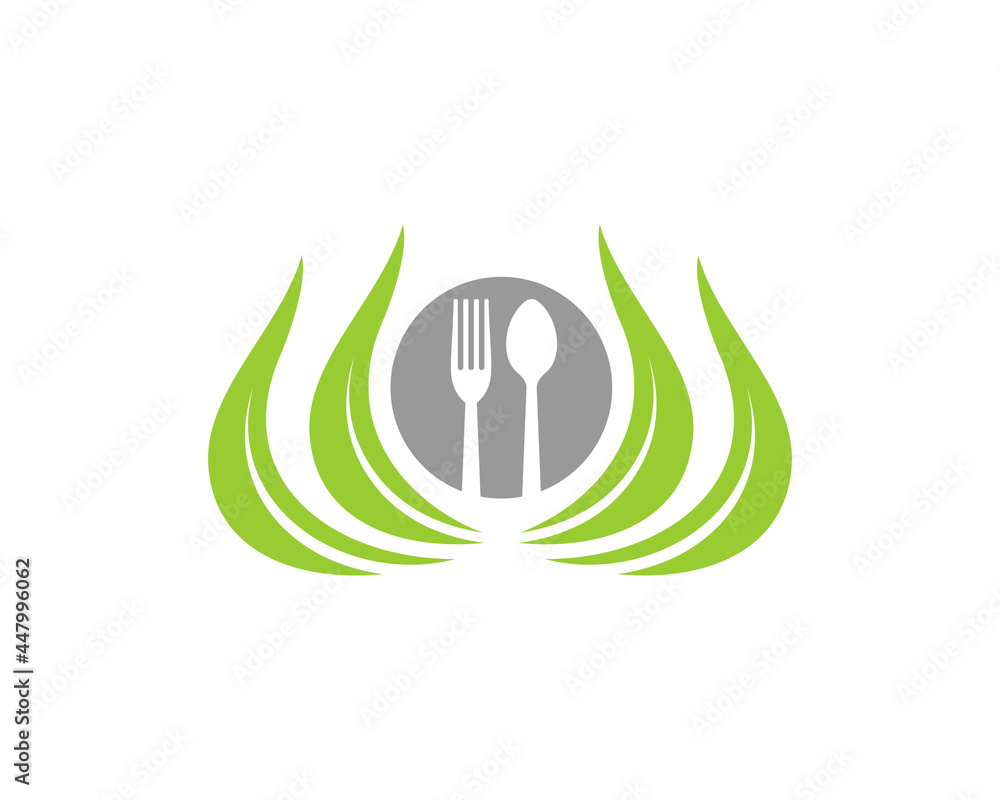 Fork, spoon and plate on the nature leaf Fork, spoon and plate on the nature leaf