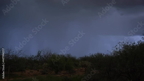 Several lightning strikes during a desert monsoon storm photo