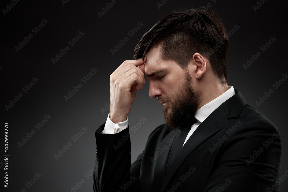 Businessman with a headache, gesturing Businessman with a headache, gesturing
