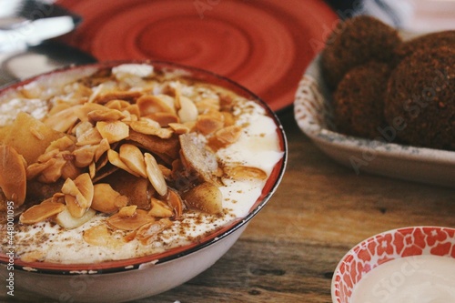 Closeup image of Palestinian food, fatteh & falafel on plate  photo