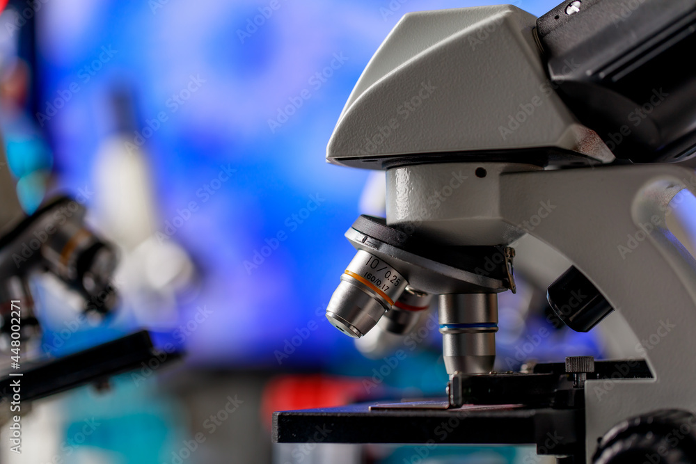 High technology scientific microscope with lens objectives for efficient magnification to observe or diagnose microorganisms or pathogenic bacteria in biology research or chemistry lab.