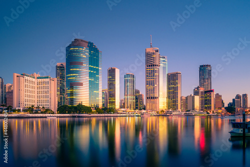Brisbane city buildings and waterfront at sunrise as seen from across the river. Brisbane is the state capital of Queensland, Australia.