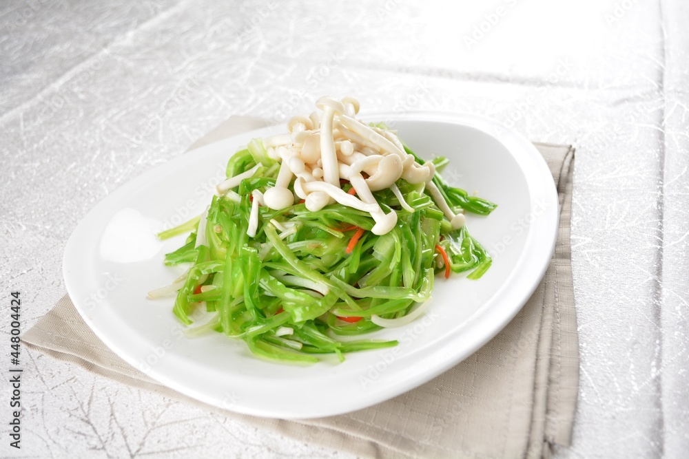 stir fried dragon vegetable with white mushroom vegetarian in soy sauce in white background asian halal vegan menu stir fried dragon vegetable with white mushroom vegetarian in soy sauce in white background asian halal vegan menu