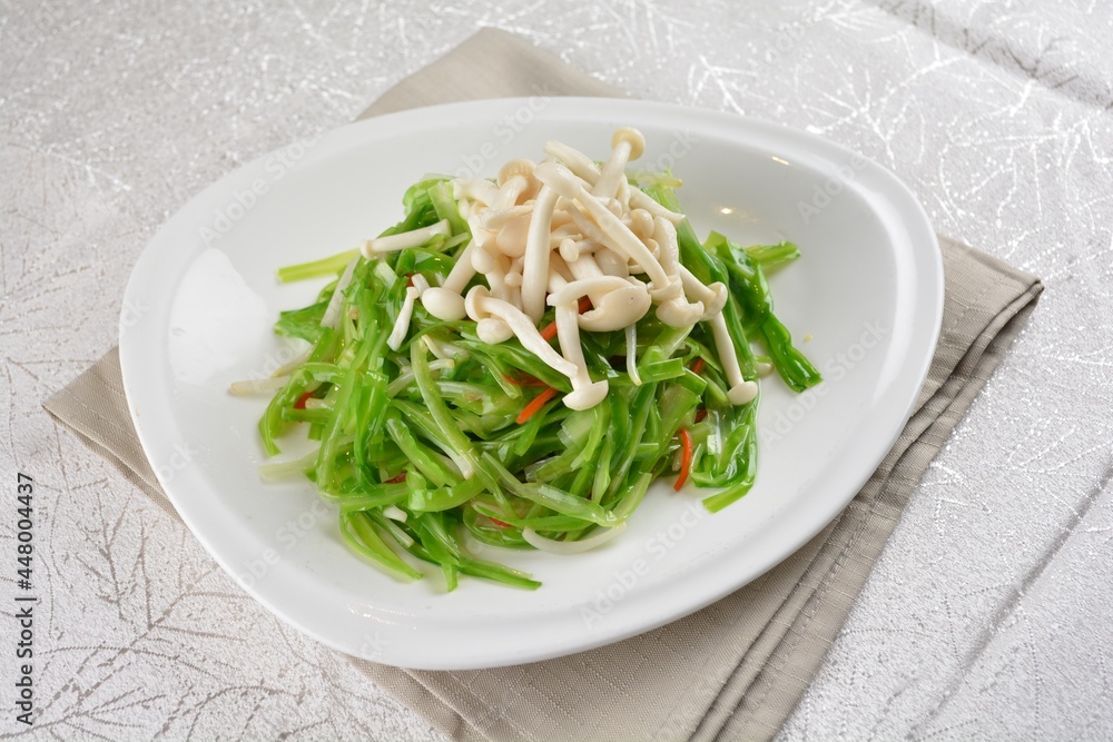 stir fried dragon vegetable with white mushroom vegetarian in soy sauce in white background asian halal vegan menu stir fried dragon vegetable with white mushroom vegetarian in soy sauce in white background asian halal vegan menu