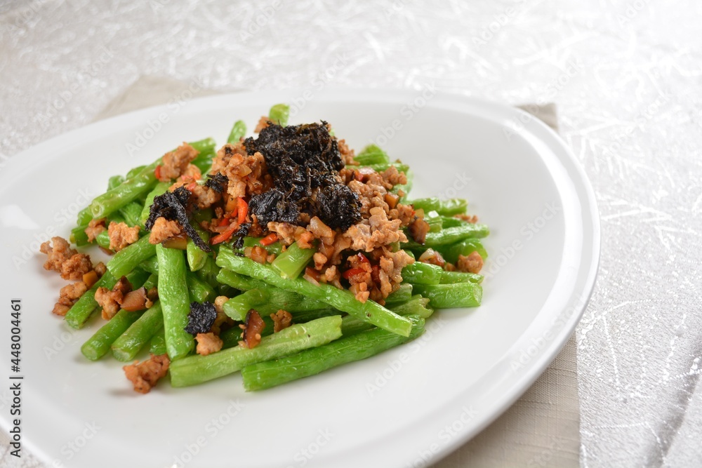 stir fried green long bean vegetables with mini shrimp paste and garlic in white background asian halal vegan menu stir fried green long bean vegetables with mini shrimp paste and garlic in white background asian halal vegan menu