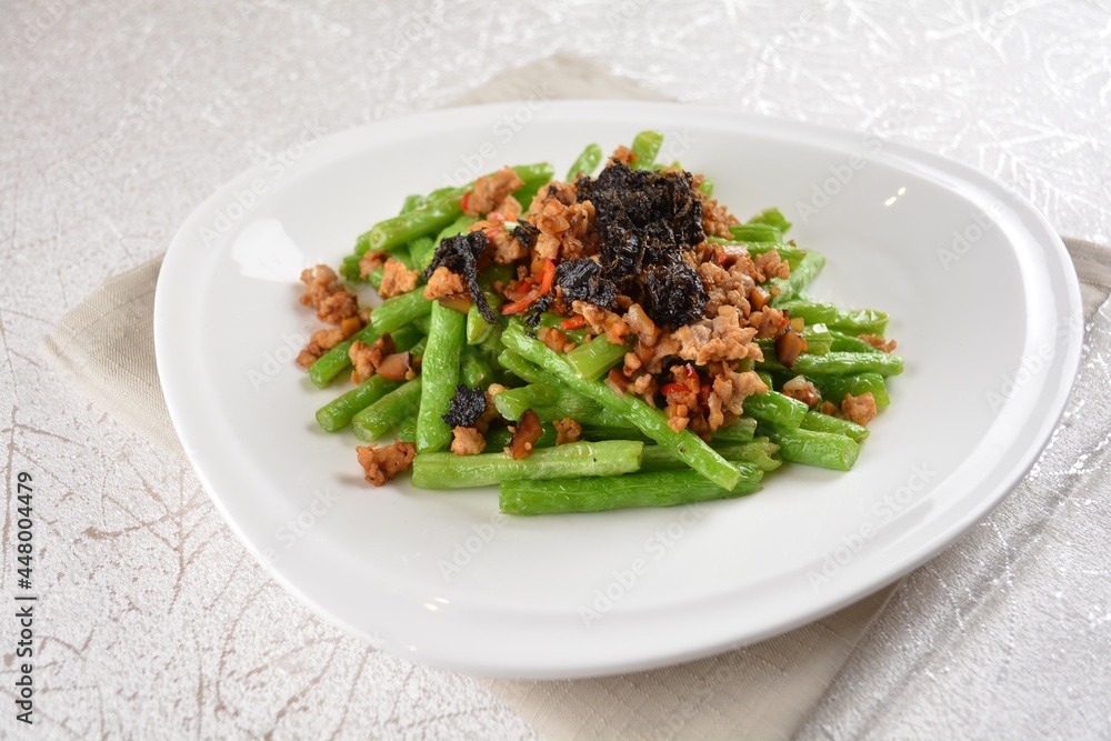 stir fried green long bean vegetables with mini shrimp paste and garlic in white background asian halal vegan menu stir fried green long bean vegetables with mini shrimp paste and garlic in white background asian halal vegan menu
