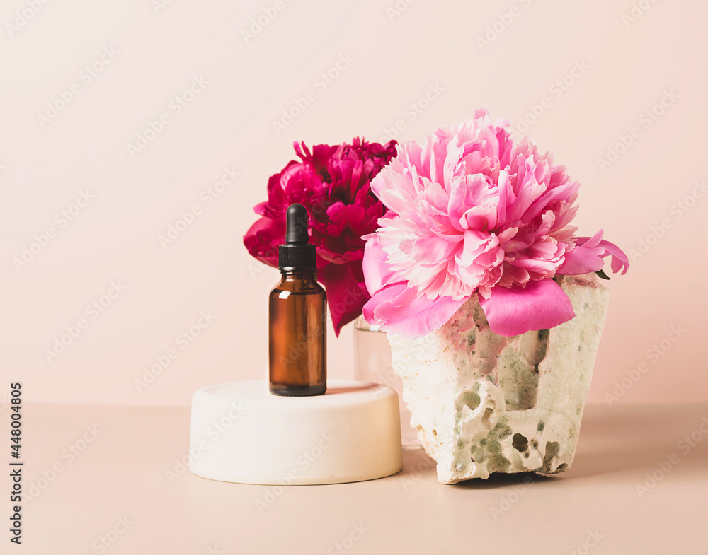 Mock up glass dropper bottle trendy podium with pastel background, flowers and stones, abstract background 