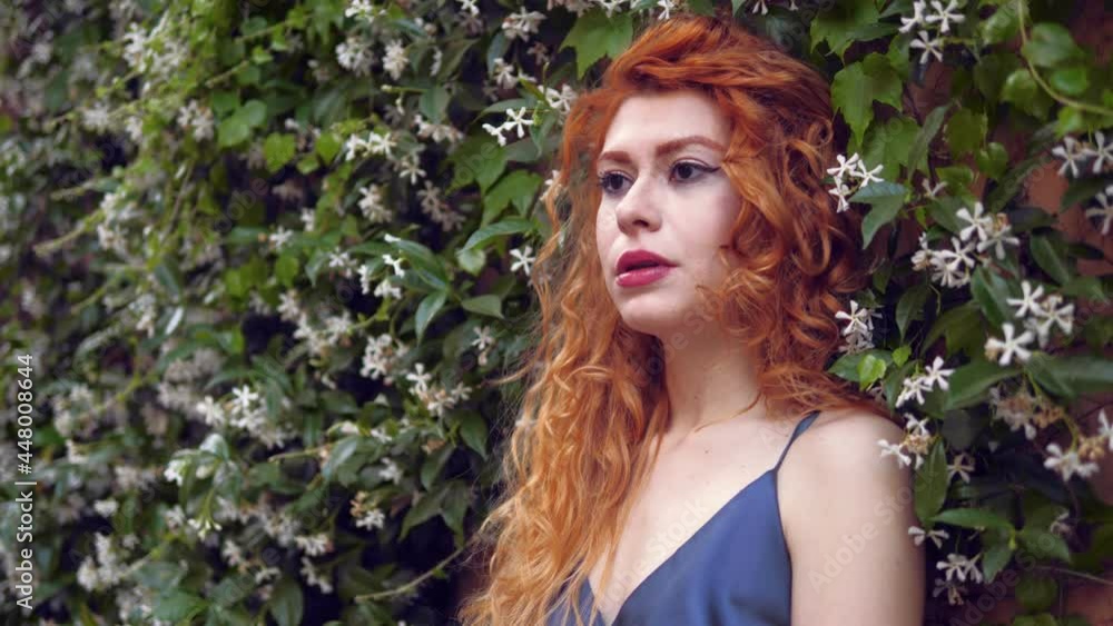 sad beautiful woman among the jasmine looking away thinking sad beautiful woman among the jasmine looking away thinking