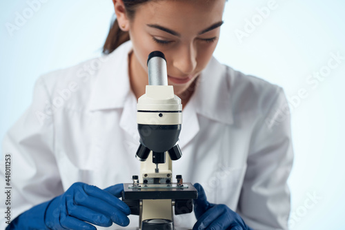 woman chemist laboratory microscope research biotechnology