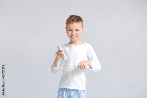 Little boy brushing teeth o...