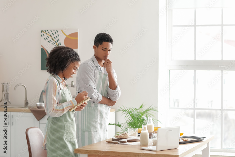 custom made wallpaper toronto digitalAfrican-American brother and sister making cookies in kitchen