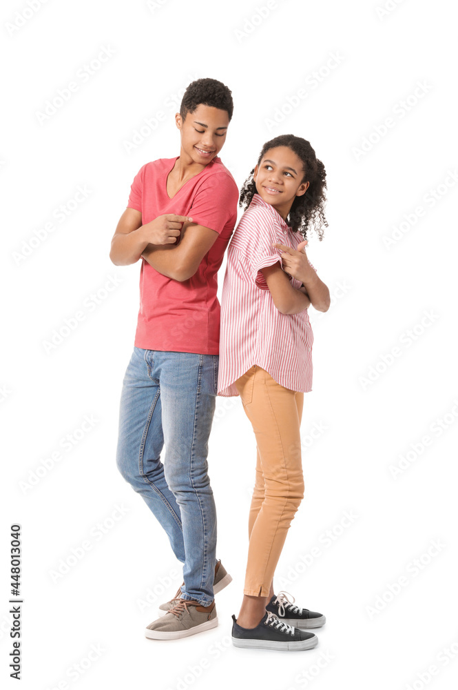 African-American brother and sister on white background African-American brother and sister on white background